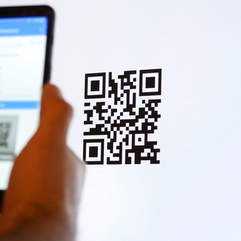 Scan QR code with smartphone on computer monitor.